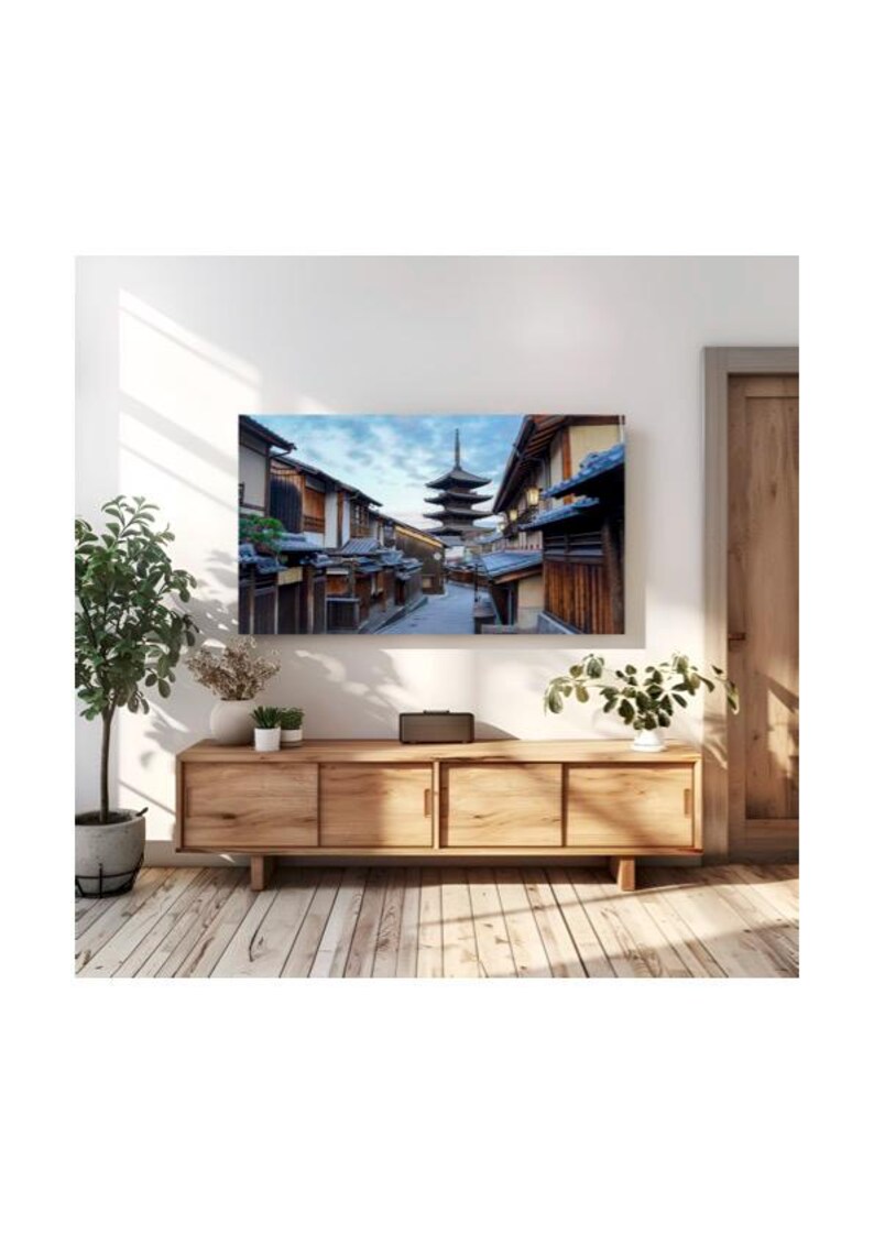 May include: A photograph of a traditional Japanese street with a pagoda in the distance. The street is lined with wooden buildings and the sky is a light blue with clouds.