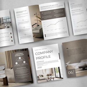 May include: A collection of brochures and a tri-fold pamphlet with interior design images and charts. The brochures feature the text "COMPANY PROFILE" and "LOREM IPSUM DOLOR SIT AMET". The color scheme is primarily white, gray, and brown.