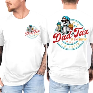 May include: White t-shirt featuring a skeleton wearing sunglasses and a blue cap, holding a drink and fries. The shirt has the text "Dad Tax" in red script, with "If I'm Buyin'" and "I'm Tryin'" in a circular design.