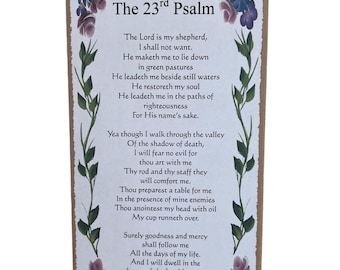 May include: A brown wooden plaque with a floral border and the text "The 23rd Psalm" and the full text of Psalm 23.