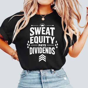 May include: Black t-shirt with the white text "SWEAT EQUITY PAYS DIVIDENDS". The design includes a sun, arrows, and water droplets. The shirt is a casual wear item.