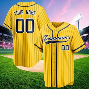 May include: A yellow baseball jersey with dark blue pinstripes and trim. The front features the text Teamname and the number 00. The back displays the text YOUR NAME and the number 00 in dark blue. The jersey has a button-down front closure.