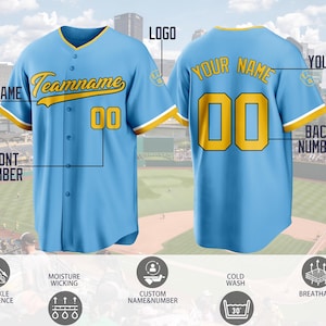 May include: A light blue baseball jersey with yellow and white trim, featuring the text Teamname and the number 00 on the front, and Your Name with the number 00 on the back. The jersey includes icons for moisture wicking and cold wash.