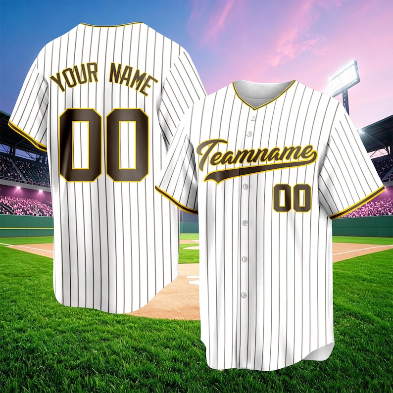 May include: A white baseball jersey with thin black pinstripes, featuring brown and yellow lettering that reads "YOUR NAME" and "00" on the back, and "Teamname" with "00" on the front. The button-down shirt has short sleeves with yellow trim.