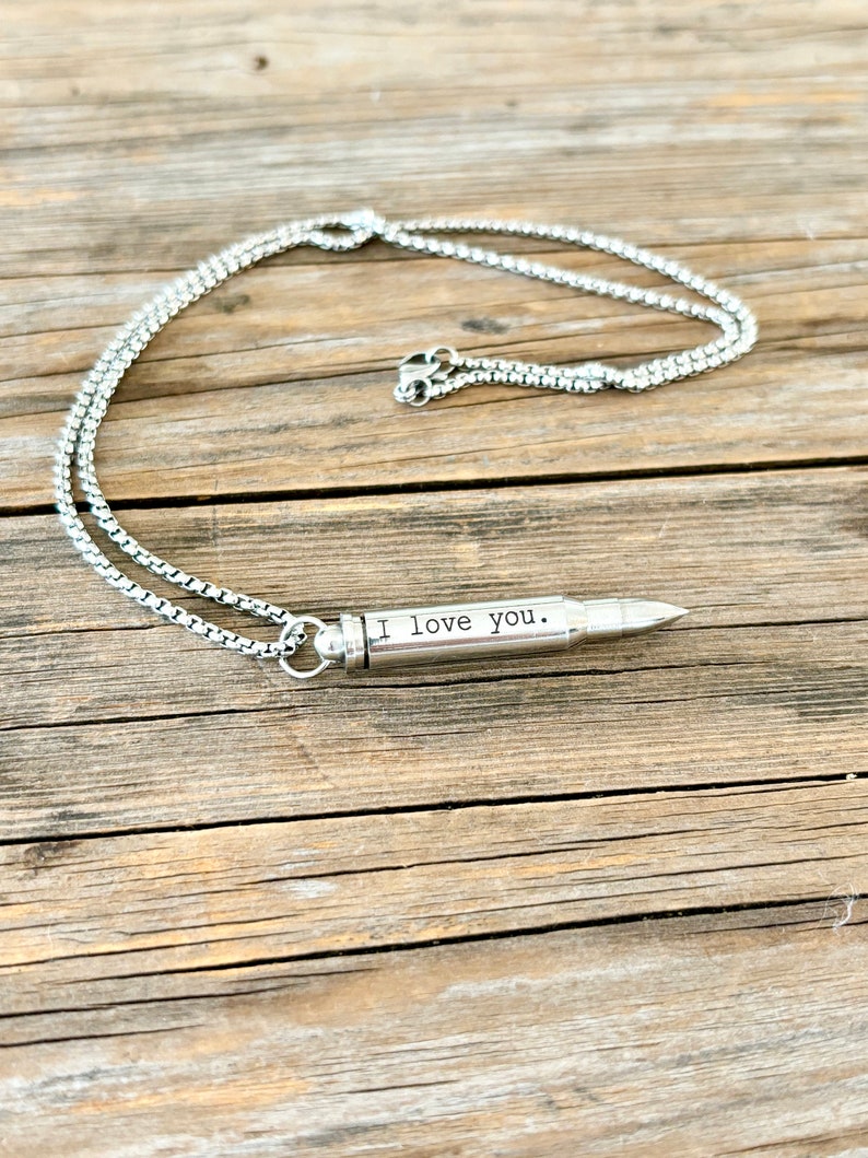 silver bullet urn necklace engraved with I Love you.