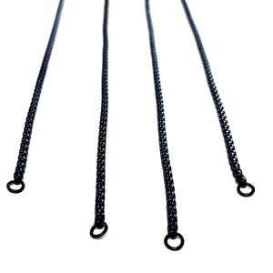 May include: Four black metal chain necklaces with circular clasps are displayed against a white background. The chains are made of small, interlocking links. The chains are evenly spaced and angled towards the viewer.