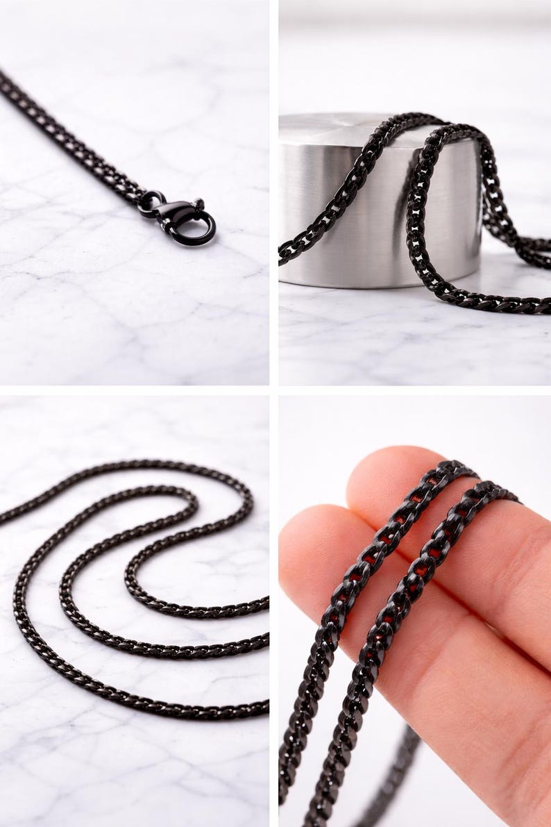 May include: Close-up images of a black chain necklace. The necklace, with small interlocking links, is shown with a lobster clasp. It's displayed on a white marble surface and a silver cylinder.