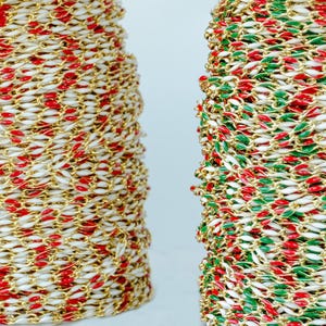 May include: Two spools of gold chain with red and white enamel, and green and white enamel.