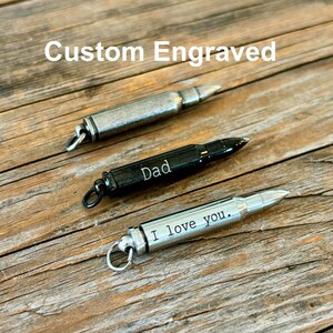 Silver, black and relic silver bullet urn necklaces for ashes.