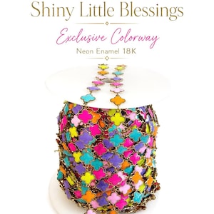 May include: A spool of colorful chain with a clover-shaped design. The chain features neon enamel in shades of pink, purple, orange, yellow, and turquoise. The text "Shiny Little Blessings Exclusive Colorway Neon Enamel 18K" is at the top.
