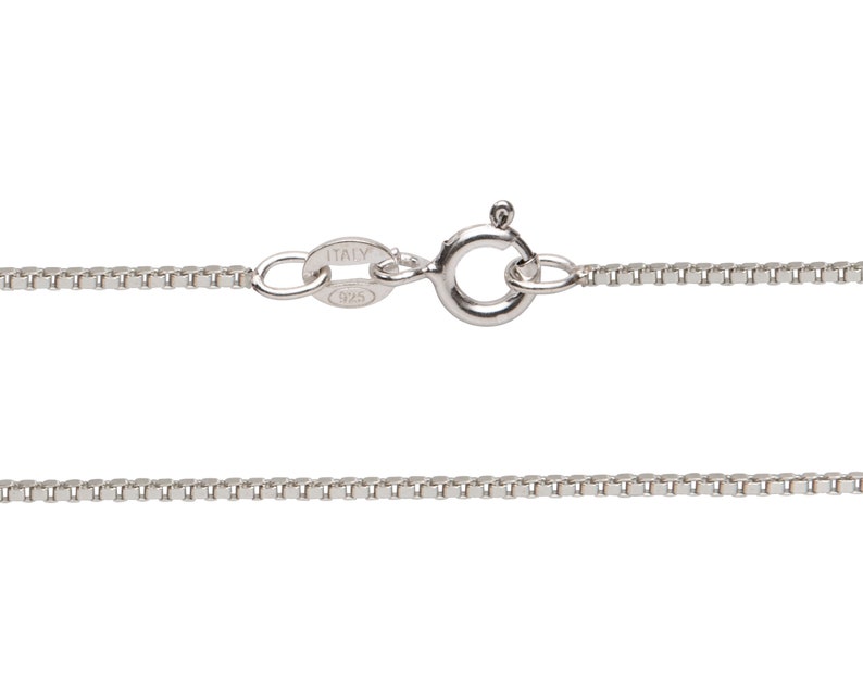 May include: A silver chain necklace with a lobster clasp and a tag that reads "ITALY 925".