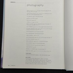 May include: A page from a book with the title "photography" in a sans-serif font. Below the title are several lines of text listing names and page numbers. The word "CREDITS" appears at the top and bottom of the page.