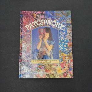 May include: A book titled "Patchwork" with a patchwork design. The cover shows a girl holding a patchwork item. The book's title is in large letters. Text on the cover reads "Over 20 New and Original Projects For You To Make."
