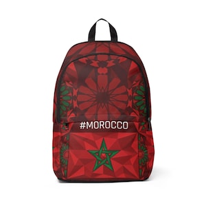May include: Red backpack with a geometric pattern and the text #MOROCCO. The backpack features a Moroccan flag design with a green star and a red background. The backpack has a black handle and straps.