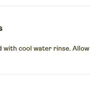 May include: The text reads Care instructions followed by Clean with vacuum and with cool water rinse. Allow to completely dry before use. The text is presented in a dark brown font against a plain white background with a small upward arrow icon.