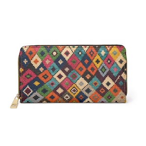 May include: A rectangular wallet with a colourful geometric pattern. The wallet features a repeating diamond design in shades of orange, blue, green, pink, and yellow. It has a gold-coloured zip and pull.