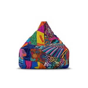 May include: A colorful beanbag chair with a patchwork design. The chair features a variety of fabrics in vibrant colors and patterns, including stripes, animal prints, and sequins. The beanbag is a triangular shape.