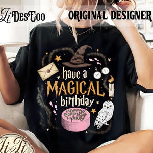 May include: Black t-shirt with a magical birthday design. The design includes a wizard hat, stars, an owl, and the text "have a MAGICAL birthday". A pink cake with "Happy Birthday Harry" is also featured.
