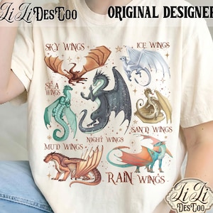 May include: A cream-coloured t-shirt displaying a vibrant illustration of different dragon species, each identified by their wing type, including "Sky Wings" and "Night Wings." The shirt also features the text "Li Li DesToo" and "Original Designer."