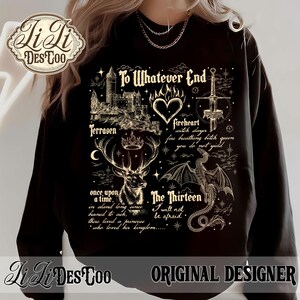 May include: Black sweatshirt with a detailed graphic design. The design includes a castle, a deer with a crown, a dragon, a sword, and text that reads "To Whatever End" and "The Thirteen". The sweatshirt also features the text "Li Li Des Too Original Designer".