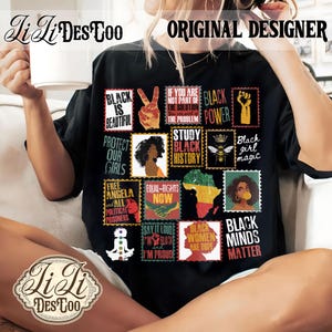 May include: A black t-shirt featuring a grid of postage stamp-style graphics with various illustrations and text including Black is Beautiful, Black Power, Study Black History, Black Girl Magic, Free Angela, Equal Rights Now, and Black Minds Matter.