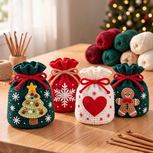 May include: Four small, round, crocheted drawstring pouches in festive colors. One dark green with a Christmas tree, one red with a white snowflake, one white with a red heart, and one dark green with a gingerbread man. Each has a matching drawstring.