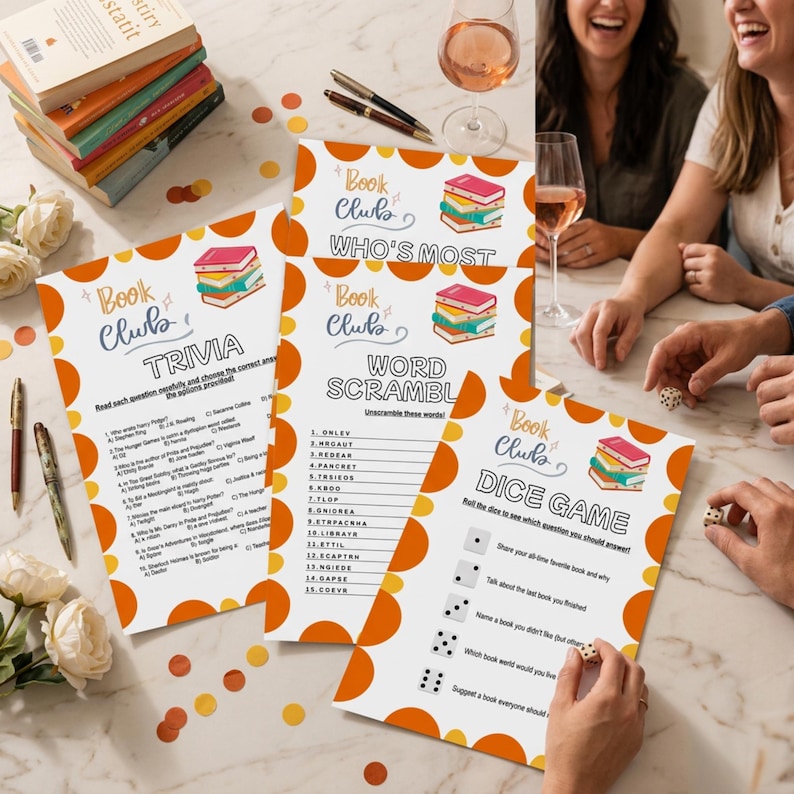 May include: A collection of book club game sheets with trivia, word scramble, and dice game prompts. The sheets have orange and white designs with the words "Book Club" and illustrations of books. Pens, books, and wine glasses are also visible.