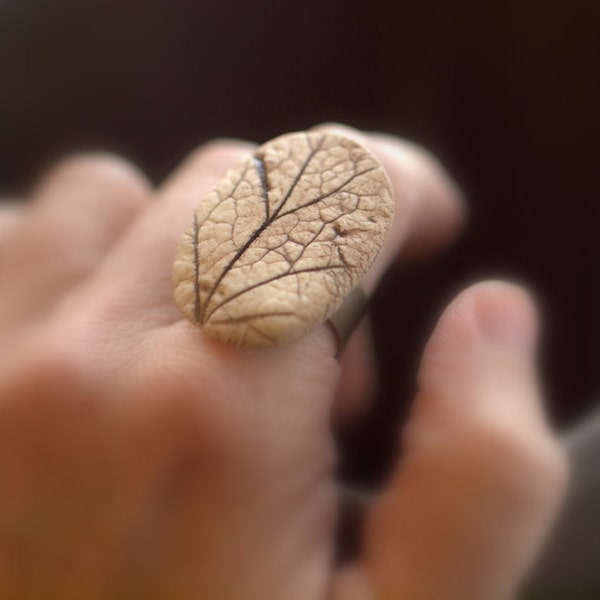 Reveal - An earthy porcelain ring with impression of a Coral Bell leaf.