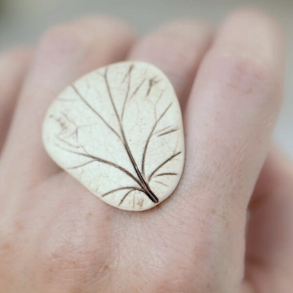 Reveal - An earthy porcelain ring with impression of a Coral Bell leaf.