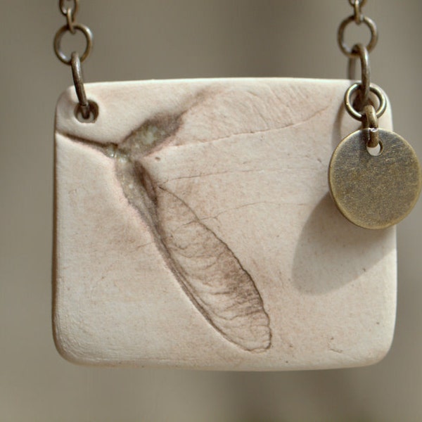 Harvest Moon - porcelain pendant with impression of maple seed.