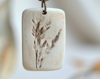 Pride - a sweet porcelain pendant with impression of tiny grass plumes.