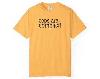 Cops Are Complicit Tee – Bold Black Text, Protest Shirt