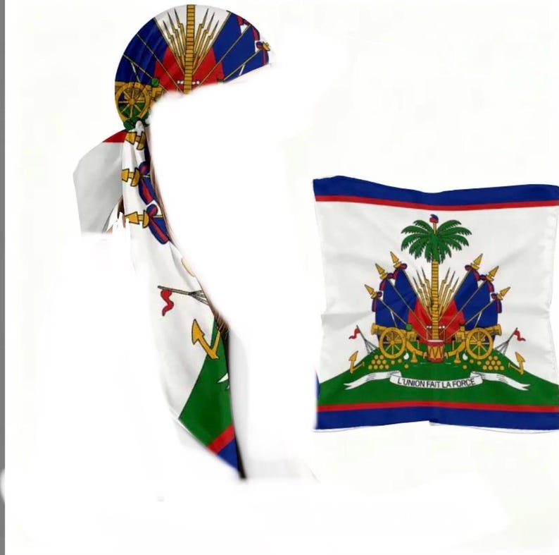 May include: Two items featuring the Haitian flag: a headscarf and a square scarf. The headscarf is white with red, blue, and gold accents, and a long tail. The square scarf has a white background with the Haitian coat of arms and a blue, red, and green border.