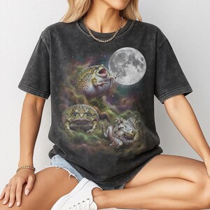 Vintage style three desert rain frogs moon graphic printed on dark washed t-shirt, cute angry rock screaming galaxy design with funny belly up pose.