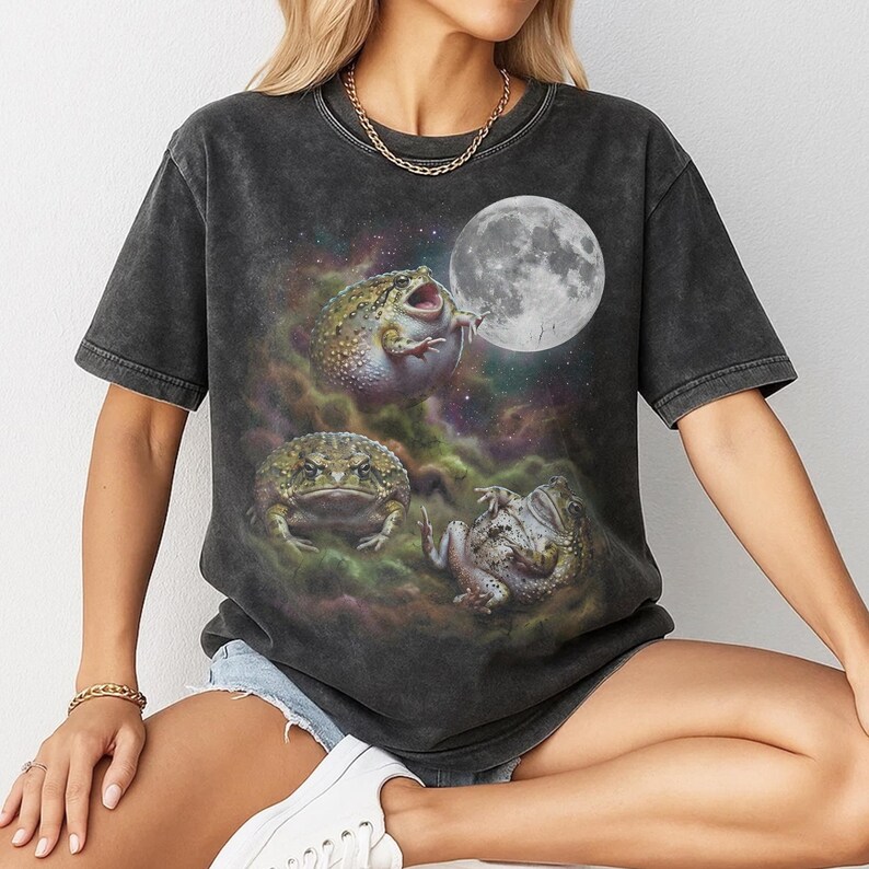 Vintage style three desert rain frogs moon graphic printed on dark washed t-shirt, cute angry rock screaming galaxy design with funny belly up pose.