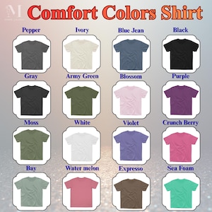 May include: A grid of t-shirts in various colors, including Pepper, Ivory, Blue Jean, and Black. The shirts are displayed with the text "Comfort Colors Shirt" at the top. Other colors include Gray, Army Green, Blossom, Purple, Moss, White, Violet, Crunch Berry, Bay, Water melon, Expresso, and Sea Foam.