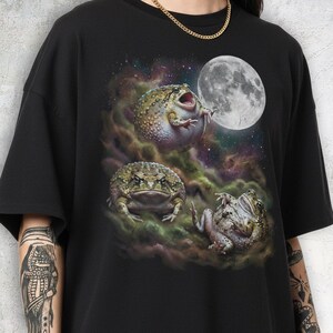 Vintage style three desert rain frogs moon graphic printed on dark washed t-shirt, cute angry rock screaming galaxy design with funny belly up pose.