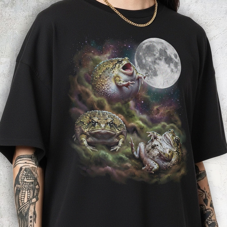 Vintage style three desert rain frogs moon graphic printed on dark washed t-shirt, cute angry rock screaming galaxy design with funny belly up pose.