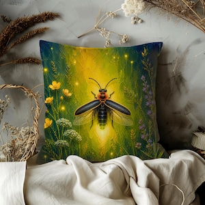 May include: Square cushion featuring a firefly illustration. The design shows a glowing firefly with black wings, set against a backdrop of yellow and green foliage, with yellow flowers and purple accents. The cushion has a dark blue border.