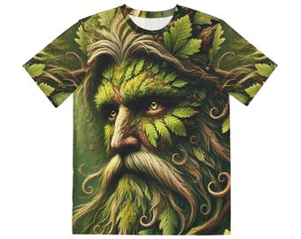 May include: A short-sleeved t-shirt featuring a detailed illustration of a green-faced figure with a long white beard and hair, adorned with leaves and foliage. The eyes are yellow, and the overall design has a fantasy theme.