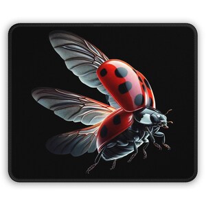 May include: A red ladybug with black spots is flying with its wings spread out. The ladybug is in focus and the background is black.