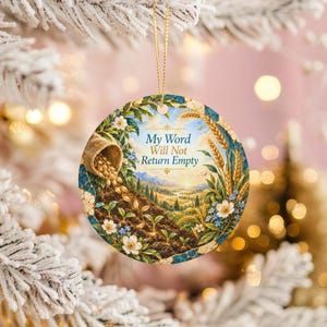 May include: A round ceramic ornament featuring a landscape illustration of a field with wheat stalks, a burlap sack spilling seeds into soil, and small green sprouts. The text "My Word Will Not Return Empty" is printed in blue in the center.