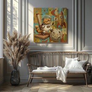 May include: A square canvas print featuring an orange cat in a spacesuit on a moon, with a rocket and a cat scratcher. The background has a retro pattern in teal, orange, and yellow. The artwork is displayed above a wicker bench, adding a touch of whimsy.