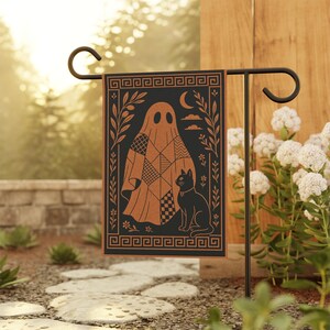 May include: A black and copper-colored garden flag featuring a ghost with a patchwork design and a black cat. The flag has a decorative border and is displayed on a black metal stand. The design includes a moon, clouds, and floral elements.