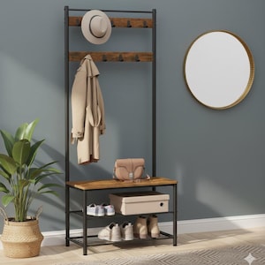 May include: A black metal hall tree with a wooden bench and shelves. A beige coat and hat hang from the top. A purse, shoes, and a box are on the shelves. A potted plant and a round mirror are also in the image.