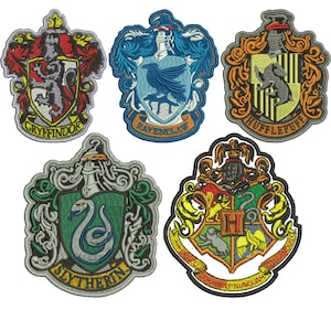 May include: Five embroidered patches depicting the Hogwarts house crests: Gryffindor, Ravenclaw, Hufflepuff, Slytherin, and Hogwarts. Each patch features a distinct colour scheme and design, with the house name embroidered at the base.