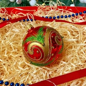 Handmade Red Ornament – Glass Christmas Bauble with Gold Swirls and Green Details – Festive Holiday Decoration – Luxury Xmas Decor