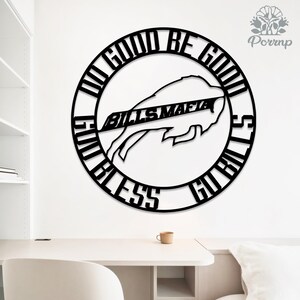 May include: Black metal wall art featuring the Buffalo Bills logo and the words "DO GOOD BE GOOD, GO BILLS, BLESS BILLS MAFIA". The circular design is suitable for home or office decor. The logo is a stylized buffalo.
