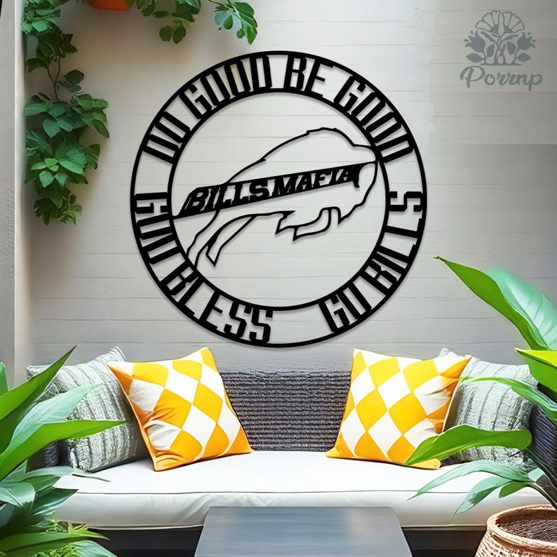 May include: Black metal wall art featuring the Buffalo Bills logo and the words "Do Good, Be Good, God Bless, Go Bills" in a circular design. The Bills Mafia text is centered within the logo. The artwork is displayed on a white wall.