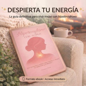 May include: A rose gold tablet displays the cover of an ebook titled "Hipotiroidismo con alma." The cover features a pink silhouette of a woman's profile and neck. The text "DESPIERTA TU ENERGÍA" is at the top. The ebook is on a beige armchair.